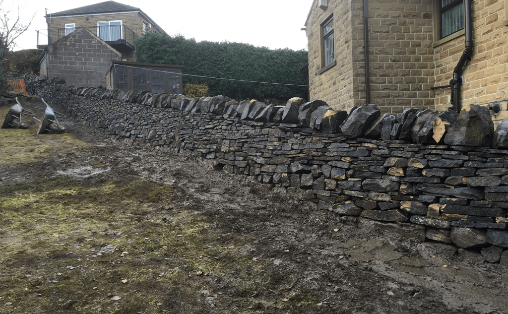 Completed dry stone wall with hedgehog smoot