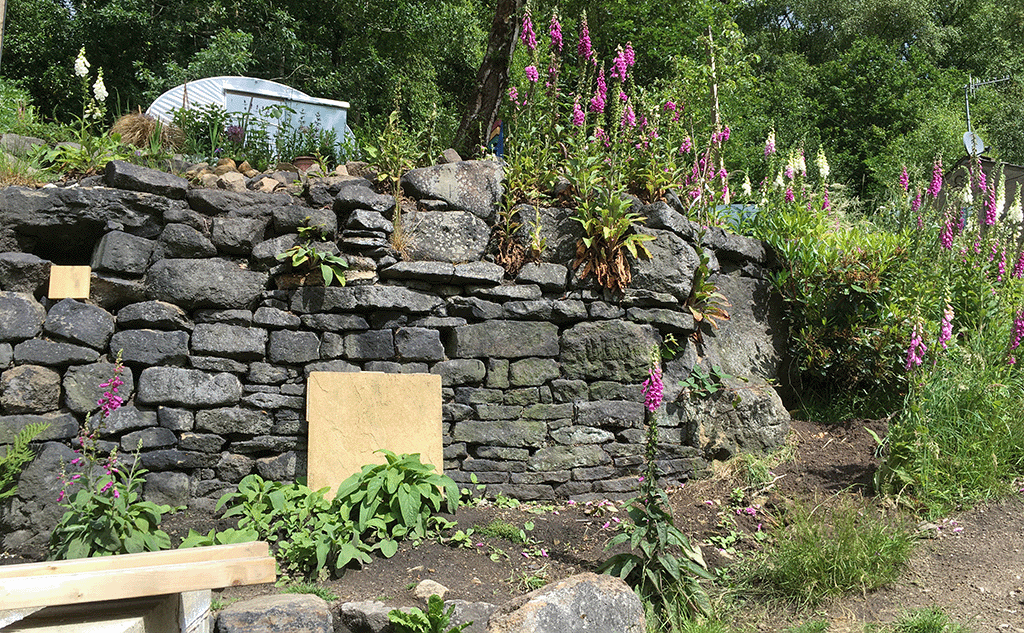 Reclaimed giant gritstone garden retaining wall