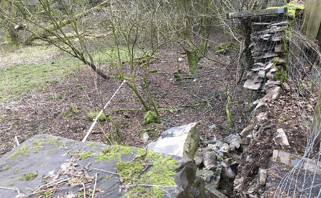 Collapsed lime mortar stone wall