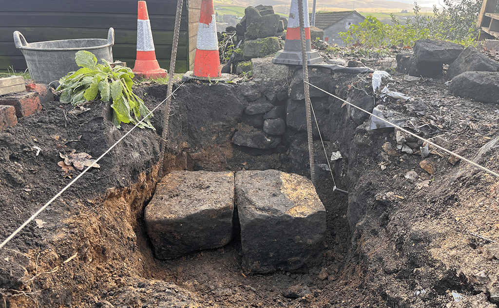 Progress rebuilding dry stone wall in Littleborough
